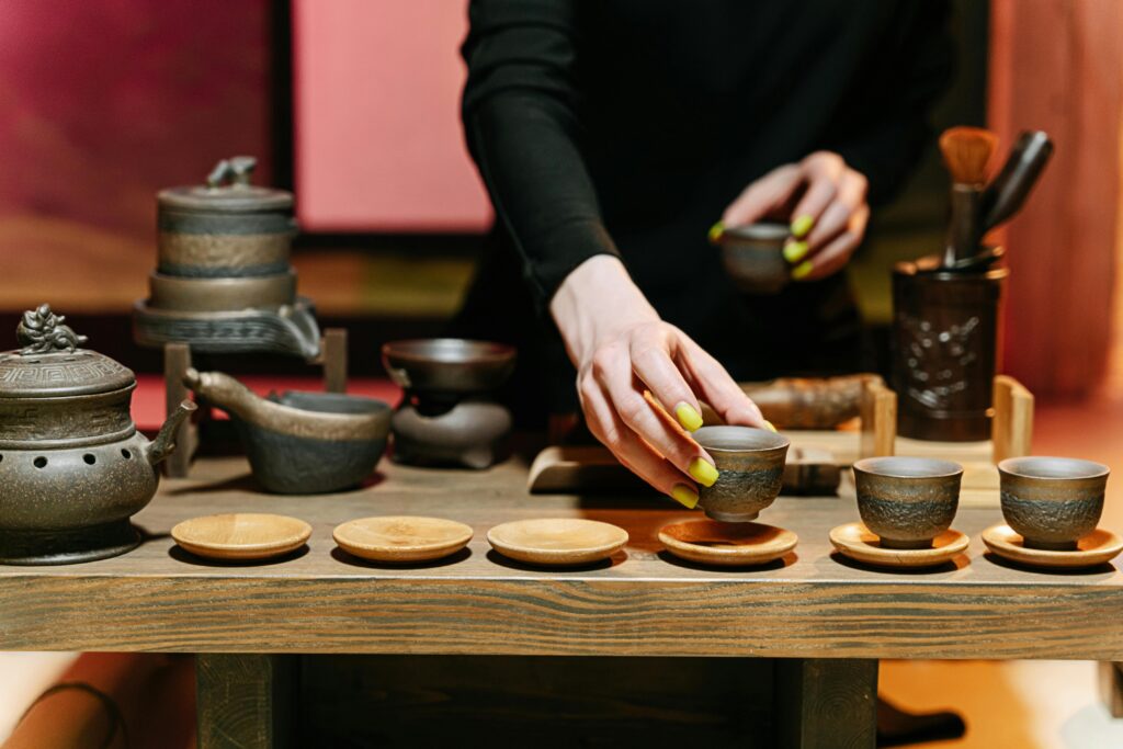 Beautiful arrangement of a traditional tea set during a tea ceremony, showcasing elegance and culture.