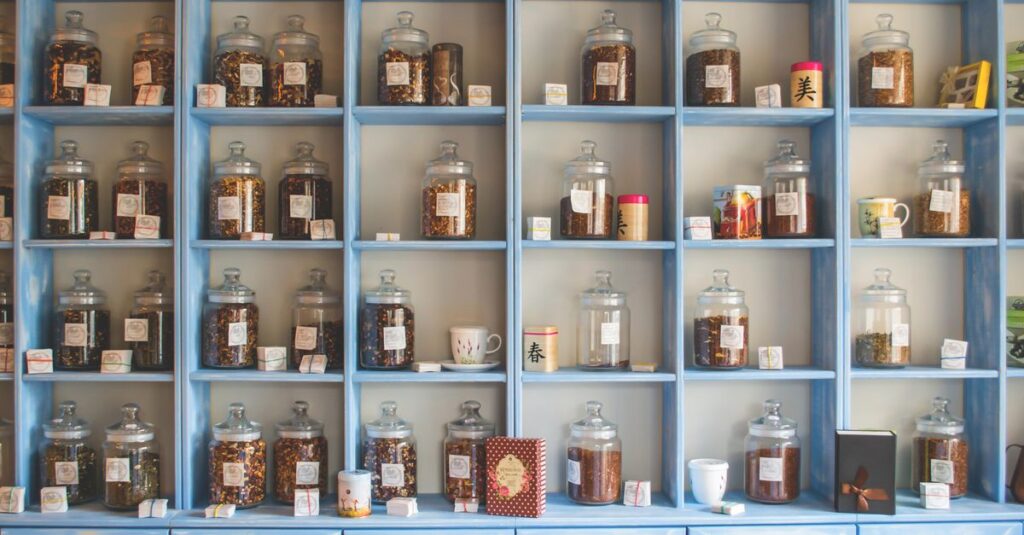 Organized display of herbal tea jars on vibrant blue shelves in a shop.