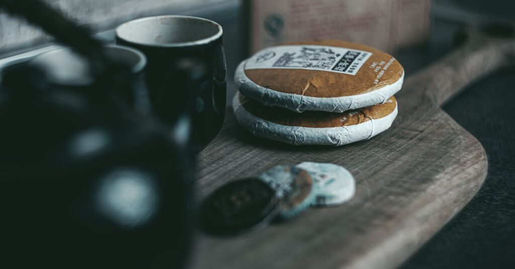 An evocative still life featuring puerh tea cakes and a ceramic teapot for a traditional tea experience.