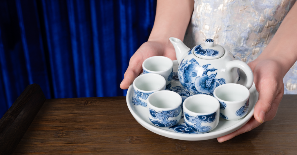 Beautiful Chinese blue and white tea set on a wooden table, perfect for elegant tea ceremonies.
