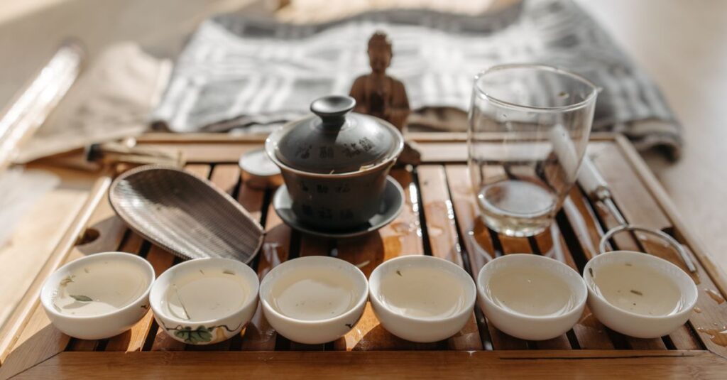 A serene display of a traditional tea ceremony set with teacups on a wooden tray, radiating cultural elegance.