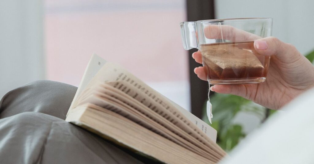 A cozy scene featuring a book and a cup of tea, evoking relaxation.
