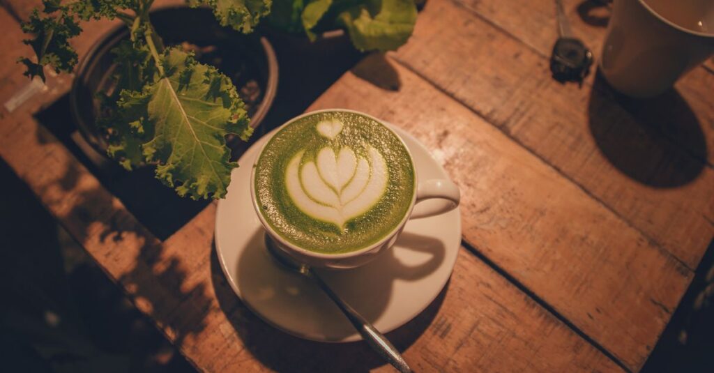 A warm indoor scene of a matcha latte with beautiful latte art on a rustic wooden table.